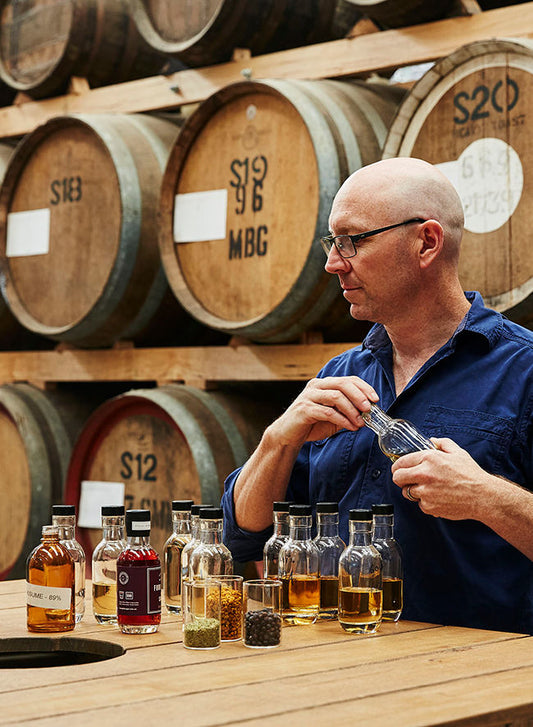 Cameron Mackenzie experimenting with gin in the Healesville distillery. 